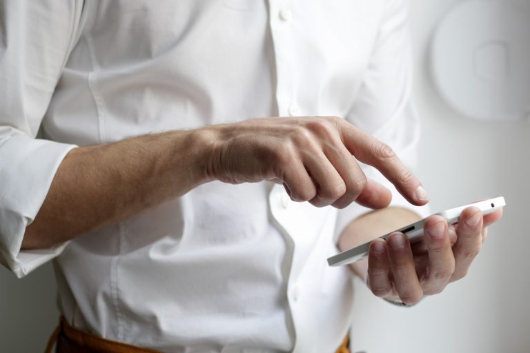 man doing business on mobile device